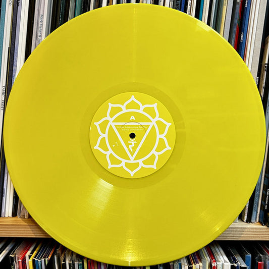 Lado A del vinilo Marshall Jefferson – Yellow Meditation For The Dance Generation 12" amarillo de Utter, etiqueta central geométrica blanca sobre amarillo con marca A visible.