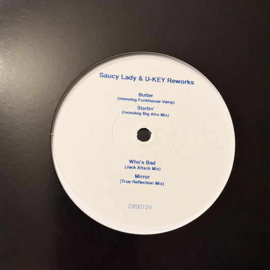Lado B del vinilo Saucy Lady & U-Key – Reworks, etiqueta blanca con títulos y número de catálogo DR0015V.