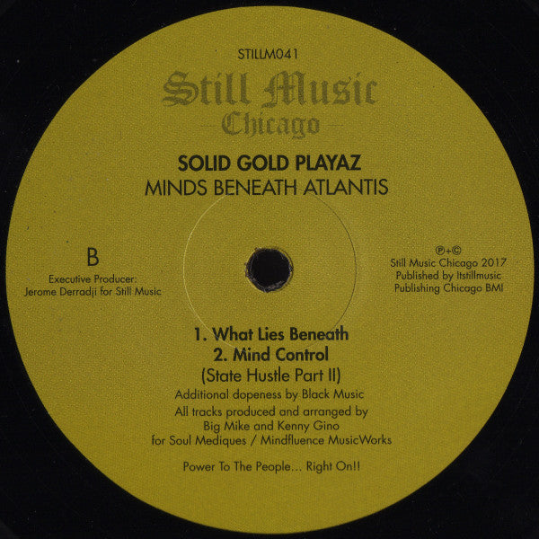 Contraportada del vinilo Solid Gold Playaz – Minds Beneath Atlantis publicado por Still Music. Texto impreso: lado B con títulos, créditos de producción y subtítulo “State Hustle Part II”.