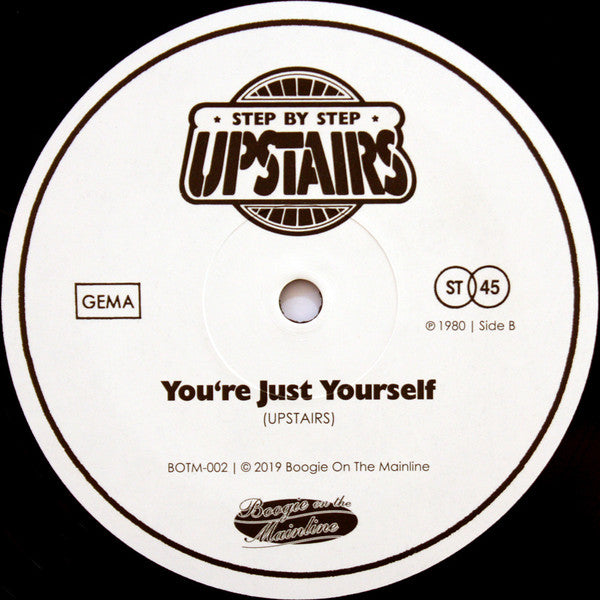 Etiqueta del lado B del vinilo "Get On A Plane / You're Just Yourself" de Upstairs. Contiene el tema "You're Just Yourself" en 45 RPM.