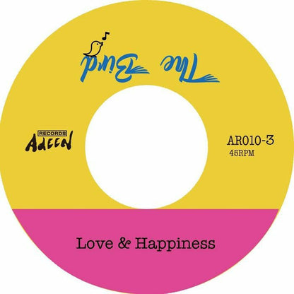 Etiqueta central del vinilo 7" Cad73 – The Bird Part 3 en su lado A, con fondo amarillo y rosa, incluye el tema “Love & Happiness”, catálogo Adeen AR010-3.