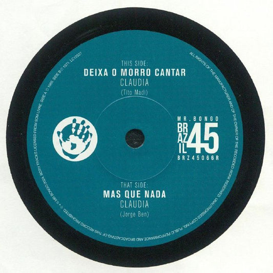 Portada delantera del vinilo de 7" de Claudia – "Deixa O Morro Cantar / Mas Que Nada", lanzado por el sello Mr Bongo. Se muestra la etiqueta del lado A con el título “Deixa O Morro Cantar”, el nombre de la artista y los créditos de composición.