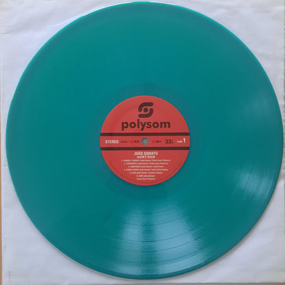 Etiqueta central del lado A del vinilo João Donato – Quem É Quem en color verde, con detalles del sello Polysom y cinco pistas visibles.