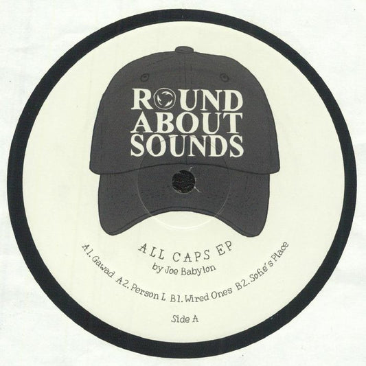 Etiqueta central lado A del vinilo Joe Babylon – All Caps EP, sello Roundabout Sounds, con títulos de pistas, créditos y diseño minimalista.