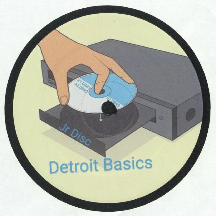Etiqueta central lado B del vinilo JR Disc – Detroit Basics #2 mostrando mano colocando disco y diseño gráfico del sello Detroit Basics.