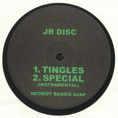 Portada delantera del vinilo JR Disc – Thrust publicado por Detroit Basics en formato 12". Incluye la lista de canciones del lado A con "Tingles" y "Special (Instrumental)". Texto impreso: "JR Disc", "Detroit Basics ASAP".