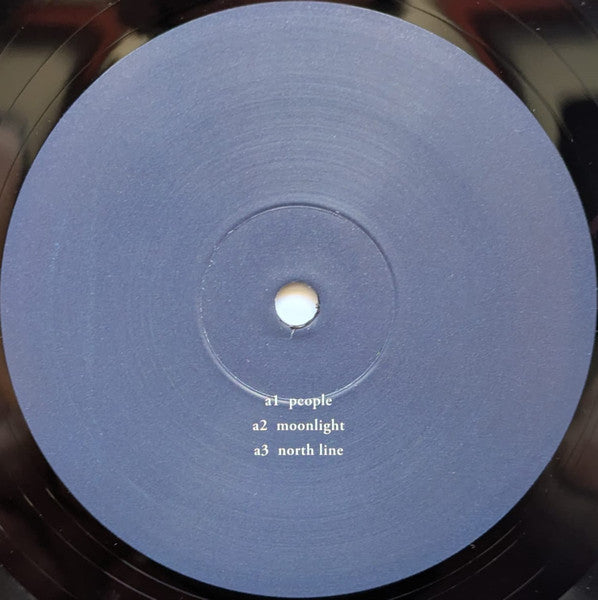 Etiqueta central lado A del vinilo Kuniyuki Takahashi – We Are Together en Mule Musiq, con las pistas People, Moonlight y North Line.