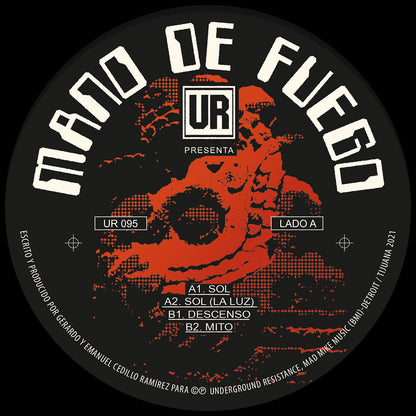 Lado A del vinilo Mano De Fuego – UR Presenta Mano De Fuego, label Underground Resistance 12", arte rojo y negro, catálogo UR 095 y tracks A1 y A2 visibles.