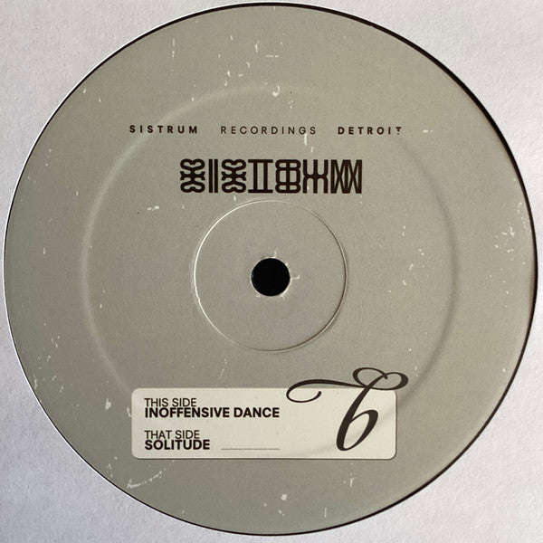 Portada trasera del vinilo con información del sello y lista de canciones. Texto impreso: "This Side: Inoffensive Dance / That Side: Solitude".
