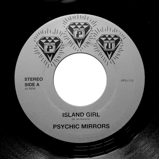 Etiqueta central del lado A del vinilo Psychic Mirrors – Island Girl / Shock Treatment en formato 7", 45 RPM del sello Peoples Potential Unlimited; muestra el lado A con diseño de tres diamantes, créditos de M. de Grand IV y número de catálogo PPU-115, ideal para coleccionistas y DJs que aprecian el arte clásico del vinilo.