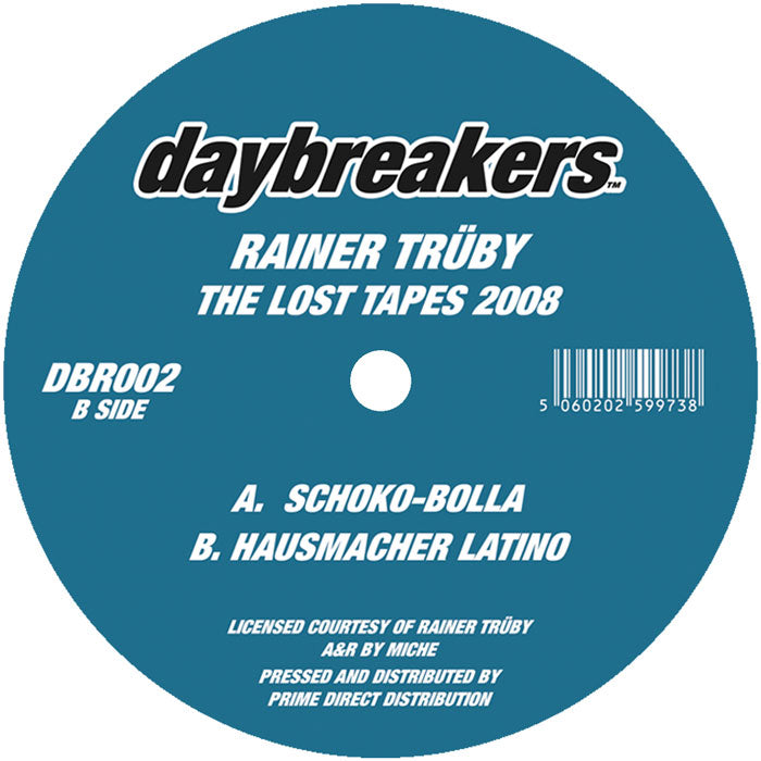 Etiqueta central del vinilo Rainer Trüby – The Lost Tapes 2008, lado B del sello Daybreakers 12", con créditos, catálogo DBR002 y pistas Schoko-Bolla y Hausmacher Latino en fondo azul.