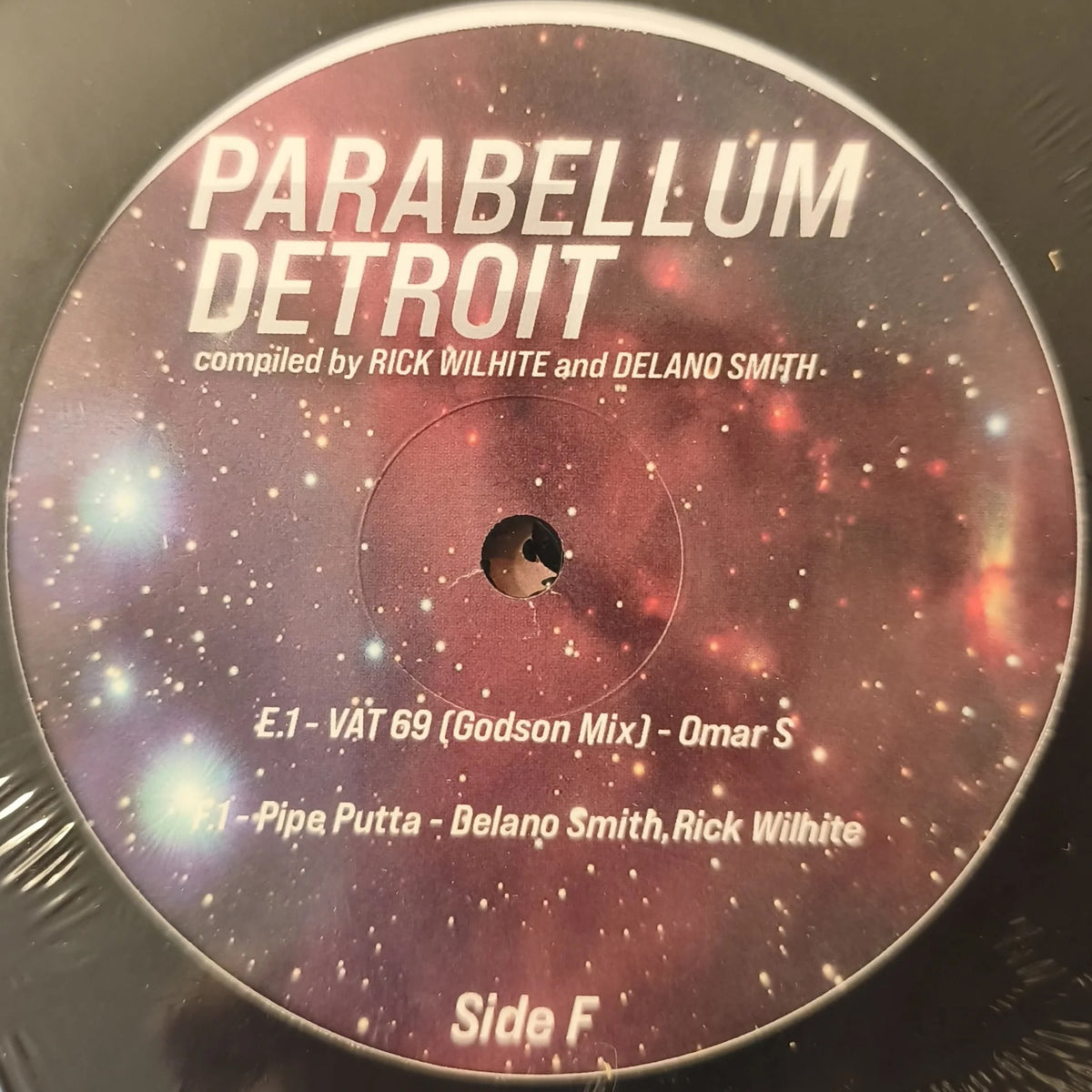 Lado F del vinilo Rick Wilhite & Delano Smith – Parabellum Detroit, label cósmico con créditos, pistas E1/E2 visibles