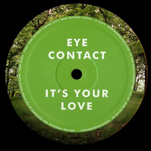 Etiqueta verde del lado A del vinilo The Other People Place – Lifestyles Of The Laptop Café con los temas “Eye Contact” y “It’s Your Love”.
