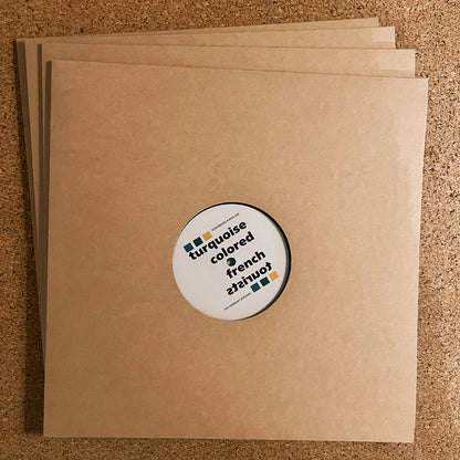 Funda interior del vinilo 12" EP Turquoise Colored French Tourists – The Cremant Sessions, sobre kraft con disco visible y estética minimalista.