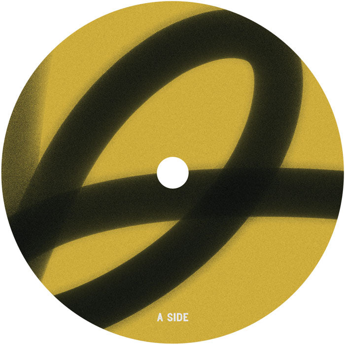 Etiqueta central lado A del vinilo Varios Artistas – Blueprint en 12" de MUJA, con diseño circular negro sobre fondo amarillo.